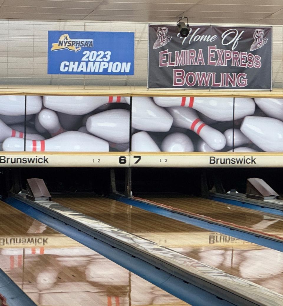 The 2023 NYSPHSAA champion banner of the Elmira boys bowling time is up on the wall at Dixie Lanes in Southport.