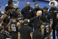 South Carolina head coach Frank Martin, center right, instructs his team during a timeout in the first half of an NCAA college basketball game against Kentucky in Lexington, Ky., Saturday, March 6, 2021. (AP Photo/James Crisp)