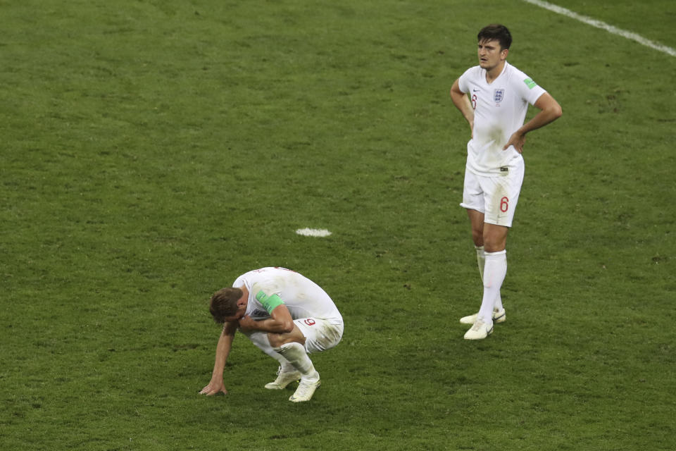 <p>Harry Kane and Harry Maguire are dejected at the final whistle </p>