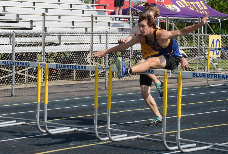 Ida's Brandon Commet wins the high hurdles at the Lenawee County Athletic Association track and field championships at Ida on Tuesday, May 21, 2024.