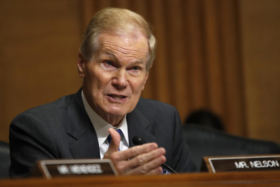 FILE - In this June 26, 2018 file photo, Sen. Bill Nelson, D-Fla., asks questions about separated children being housed in Florida, of Health and Human Services Secretary Alex Azar during a Senate Finance Committee hearing on prescription drug pricing on Capitol Hill in Washington, D.C. Incumbent Democratic Sen. Nelson and Republican challenger Gov. Rick Scott are meeting in the first debate in their campaign for Florida's highly competitive U.S. Senate seat. The two will square off Tuesday, Oct. 2, 2018, for the taped event in the studios of Telemundo 51 in Miramar. (AP Photo/Jacquelyn Martin, File)