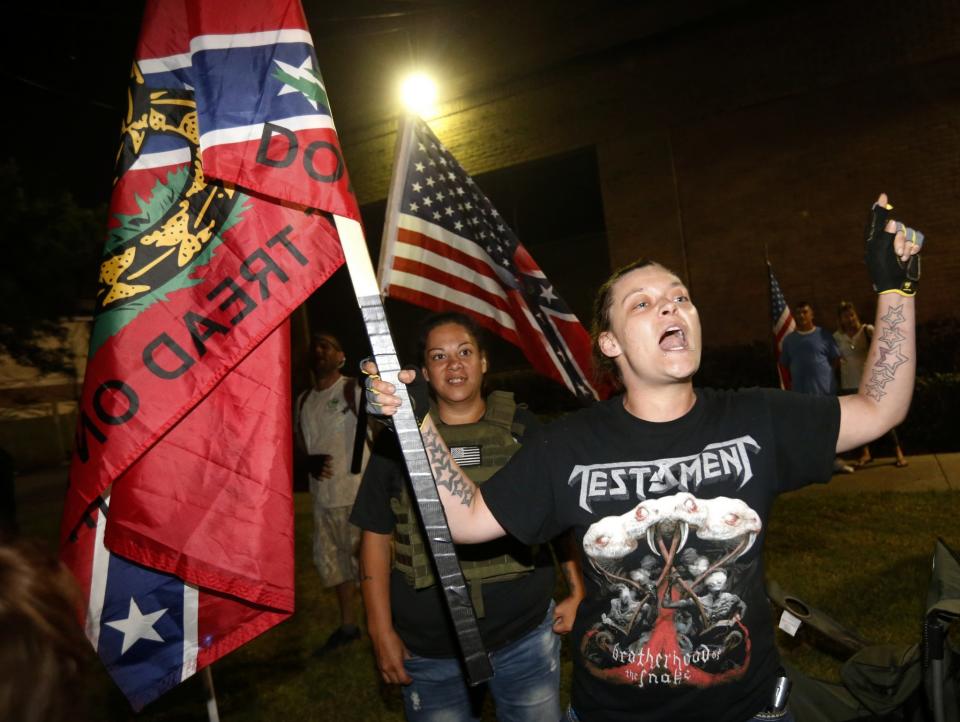 <p>People against the removal of Confederate-era statues demonstrate across the street from the Jefferson Davis statue, in anticipation of its imminent removal in New Orleans, Thursday, May 11, 2017. (Photo: Scott Threlkeld/AP) </p>