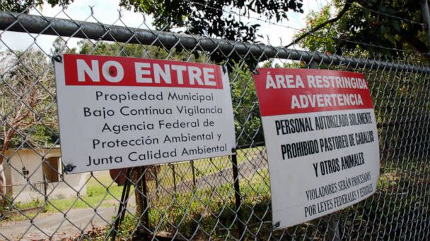 PHOTO: Warning signs are displayed on the fence surrounding the inactive Barceloneta Landfill site in Puerto Rico. About 300 tons of hazardous wastes are located in sinkholes on the property. (Lilia Geho/ABC News)
