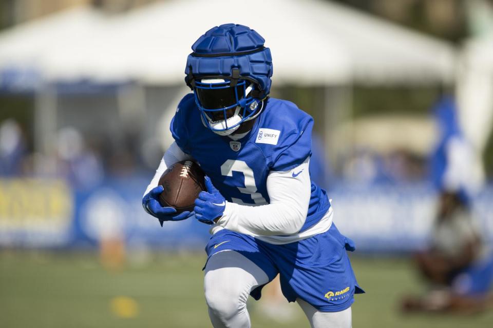 Rams running back Cam Akers runs with the football.