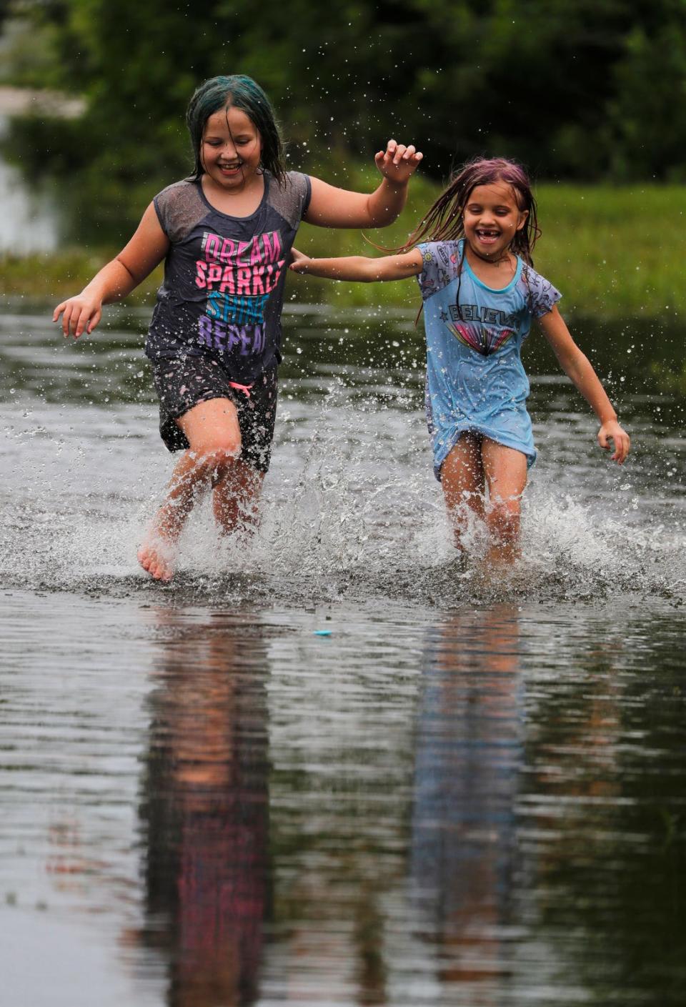 Sure, it looks like fun, but post-storm floodwater can hide a variety of hazards, and it's best to stay out of it if possible,