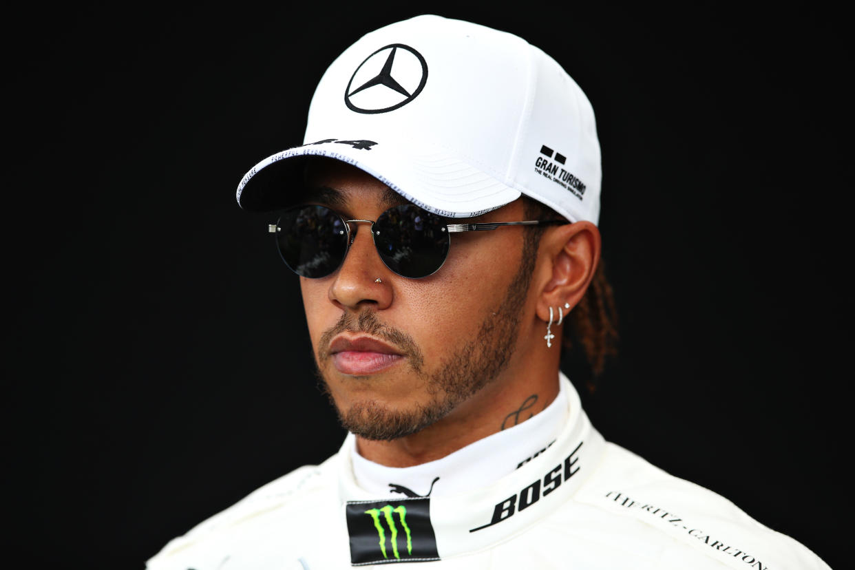MELBOURNE, AUSTRALIA - MARCH 12: Lewis Hamilton of Great Britain and Mercedes GP poses for a photo in the Paddock during previews ahead of the F1 Grand Prix of Australia at Melbourne Grand Prix Circuit on March 12, 2020 in Melbourne, Australia. (Photo by Charles Coates/Getty Images)