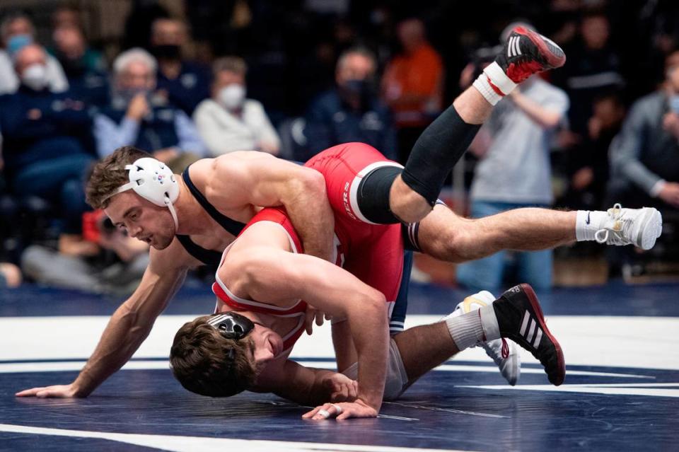 Penn State’s Brady Berge attempts a takedown on Rutgers’ Andrew Clark during a wrestling dual between Penn State and Rutgers on Sunday, Jan. 16, 2022 at Rec Hall in University Park, Pa. Penn State defeated the Scarlet Knights 27-11.