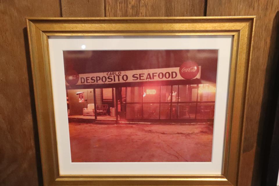 A photo of Carlo Desposito Seafood hangs on the wall at the entrance to Desposito's Seafood in Thunderbolt.