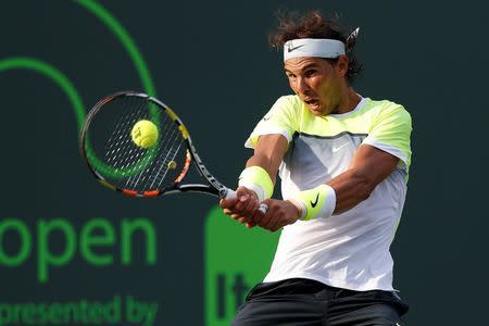 Mar 27, 2015; Key Biscayne, FL, USA; Rafael Nadal hits a backhand against Nicolas Almagro (not pictured) on day five of the Miami Open at Crandon Park Tennis Center. Nadal won 6-4, 6-2. Mandatory Credit: Geoff Burke-USA TODAY Sports