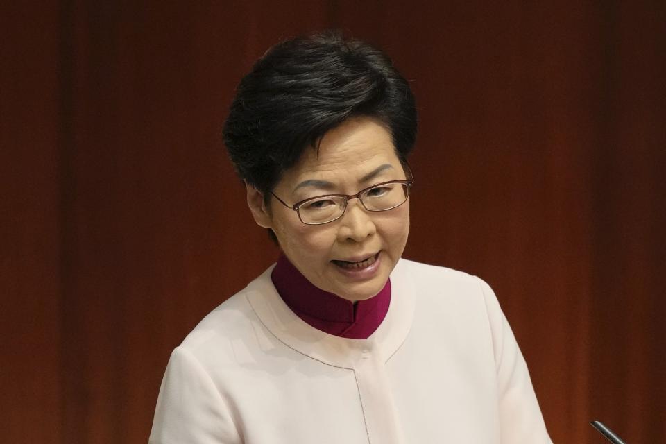 Hong Kong Chief Executive Carrie Lam delivers her policies at the chamber of Legislative Council in Hong Kong, Wednesday, Oct. 6, 2021. Lam announced a major development plan Wednesday for Hong Kong's border area with mainland China in the last annual policy address of her current term. (AP Photo/Kin Cheung)