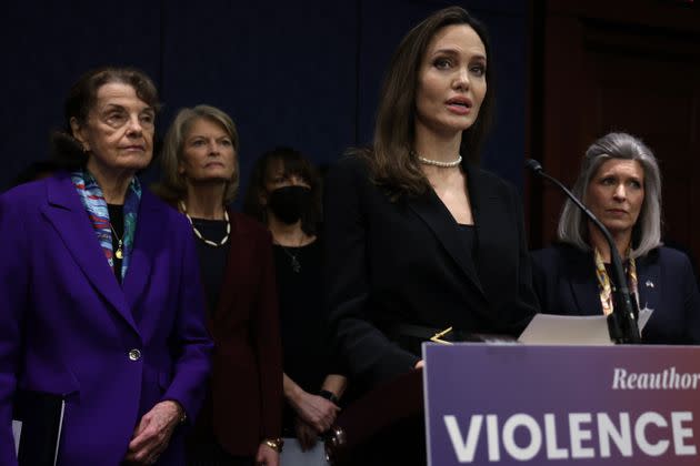 Actor Angelina Jolie speaks as Sen. Dianne Feinstein (D-Calif.), left, Sen. Lisa Murkowski (R-Alaska), National Coalition Against Domestic Violence President Ruth Glenn and Sen. Joni Ernst (R-Iowa) show support at a Wednesday news conference at the U.S. Capitol. A bipartisan group of senators announced modernized legislation on the Violence Against Women Act. (Photo: Alex Wong/Getty Images)