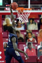 St. Peter's forward Fousseyni Drame fails a dunk attempt against Maryland during the first half of an NCAA college basketball game, Friday, Dec. 4, 2020, in College Park, Md. (AP Photo/Julio Cortez)