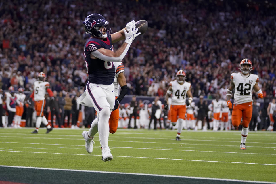 Houston Texans tight end Dalton Schultz catch a touchdown pass against the Cleveland Browns during the first half of an NFL wild-card playoff football game Saturday, Jan. 13, 2024, in Houston. (AP Photo/Eric Christian Smith)