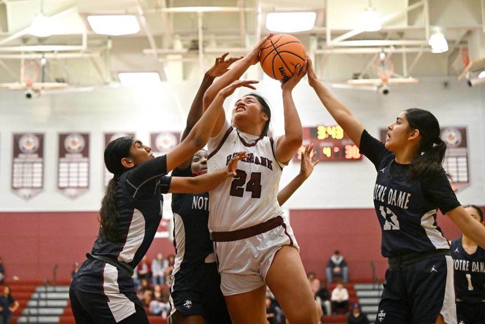 Riverbank’s Rayne Tago attacks the basket and draws a foul during the CIF Northern California Division IV playoff game with Notre Dame at Riverbank High School in Riverbank, Calif., Thursday, Feb. 29, 2024. Riverbank lost in overtime 47-46. Andy Alfaro/aalfaro@modbee.com