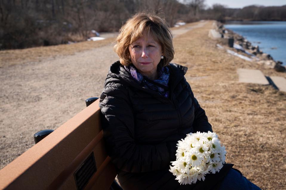 Family and friends erected a bench in Quinn Moffett’s honor in Ann Arbor, which her mother, Mary Moffett, visited in March.