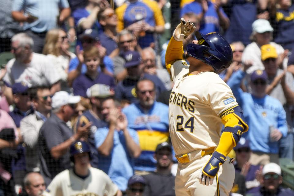 Milwaukee Brewers' William Contreras reacts after hitting a three-run home run during the third inning of a baseball game against the Pittsburgh Pirates Wednesday, May 15, 2024, in Milwaukee. (AP Photo/Morry Gash)