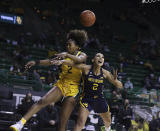 Baylor guard DiDi Richards, left, blocks the shot of West Virginia guard Kysre Gondrezick, right, in the first half of an NCAA college basketball game, Monday, March 8, 2021, in Waco, Texas. (Rod Aydelotte/Waco Tribune-Herald via AP)