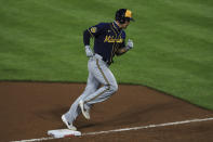 Milwaukee Brewers' Jace Peterson runs the bases after hitting a two-run home run in the ninth inning during a baseball game against the Cincinnati Reds in Cincinnati, Monday, Sept. 21, 2020. (AP Photo/Aaron Doster)