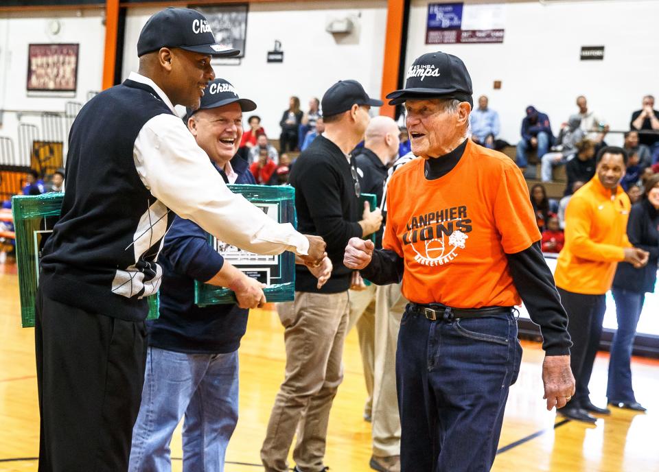 Former Lanphier coach and athletic director Arlyn Lober is honored along with the 1983 State Championship team during halftime as the Lions take on Decatur MacArthur at Lober-Nika gymnasium, Saturday, Feb. 10, 2018, in Springfield, Ill. [Justin L. Fowler/The State Journal-Register]