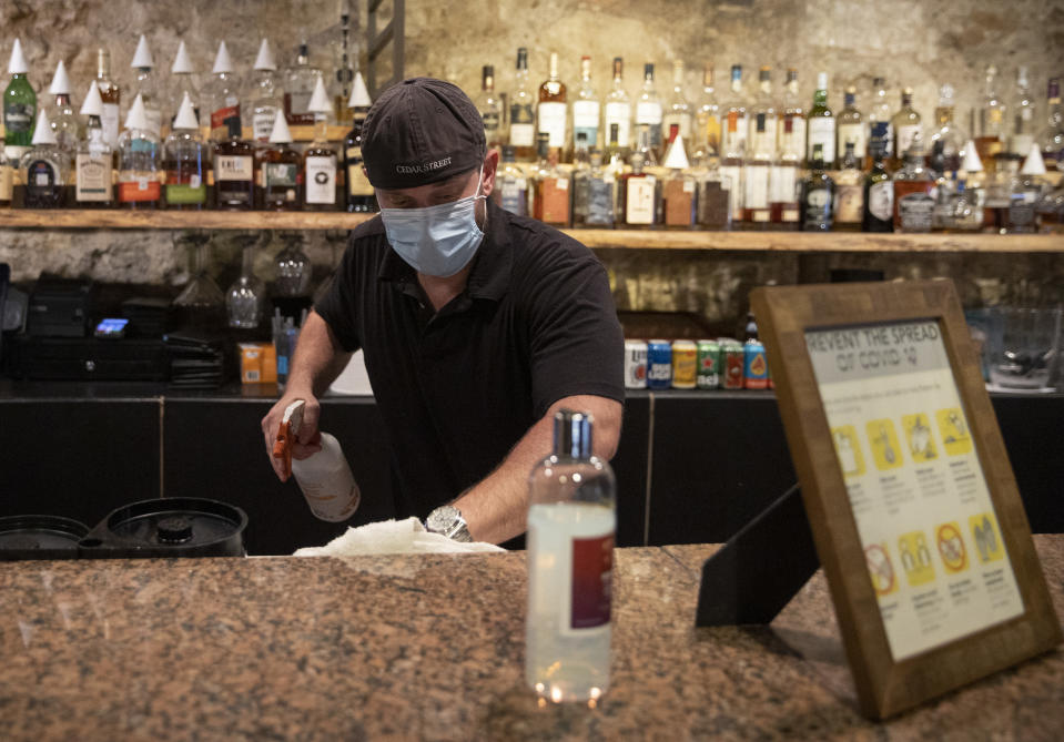 Jun 26, 2020; Austin, TX, USA; Kevin Shipp, operating partner of Cedar Street Courtyard, closes his bar on West 4th Street in Austin, Texas, on Friday June 26, 2020, after Gov. Greg Abbott ordered all bars in Texas to be closed due to the coronavirus. Mandatory Credit: Jay Janner/American-Statesman via USA TODAY NETWORK/Sipa USA