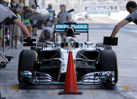 Mercedes Formula One driver Lewis Hamilton of Britain stops at the pit during the first practice session of the Abu Dhabi F1 Grand Prix at the Yas Marina circuit in Abu Dhabi November 21, 2014. REUTERS/Ahmed Jadallah