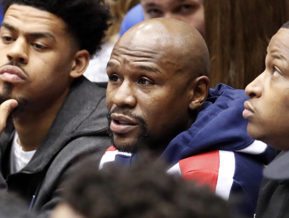 Boxer and promoter Floyd Mayweather watches the action between Duke and North Carolina State during the first half of an NCAA college basketball game in Durham, N.C., Saturday, Feb. 16, 2019. (AP Photo/Chris Seward)