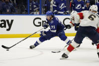 Tampa Bay Lightning center Anthony Cirelli (71) gets around Florida Panthers defenseman MacKenzie Weegar (52) and defenseman Anton Stralman (6) during the second period in Game 6 of an NHL hockey Stanley Cup first-round playoff series Wednesday, May 26, 2021, in Tampa, Fla. (AP Photo/Chris O'Meara)