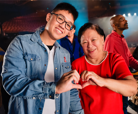 Calvin Tan, the youngest person in Singapore openly out about HIV positive status, and Iris Verghese, a pioneer HIV caregiver.  (PHOTO: SidexSide Photography)