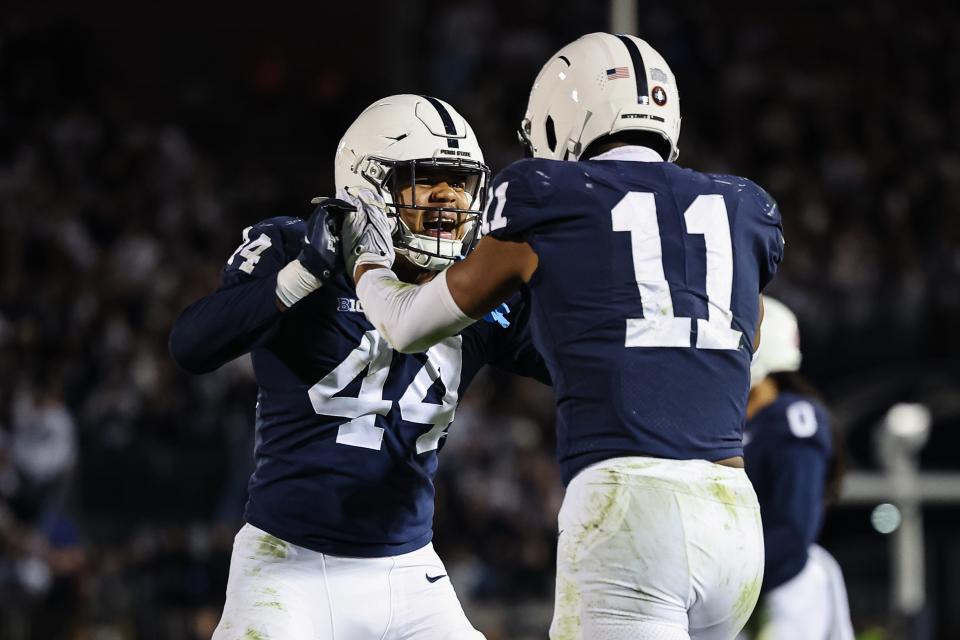 STATE COLLEGE, PA - NOVEMBER 26: Abdul Carter #11 of the Penn State Nittany Lions celebrates with Chop Robinson #44 after recording a sack against the Michigan State Spartans during the second half at Beaver Stadium on November 26, 2022 in State College, Pennsylvania. (Photo by Scott Taetsch/Getty Images)