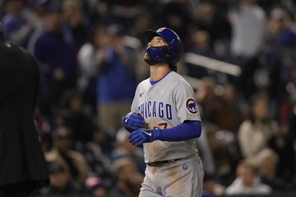 Chicago Cubs' Dansby Swanson looks up as he rounds bases after hitting a home run during the fifth inning of a baseball game against the Washington Nationals in Washington, Monday, May 1, 2023. (AP Photo/Manuel Balce Ceneta)