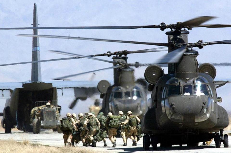 US soldiers disembark from a helicopter at Bagram airbase in 2002.