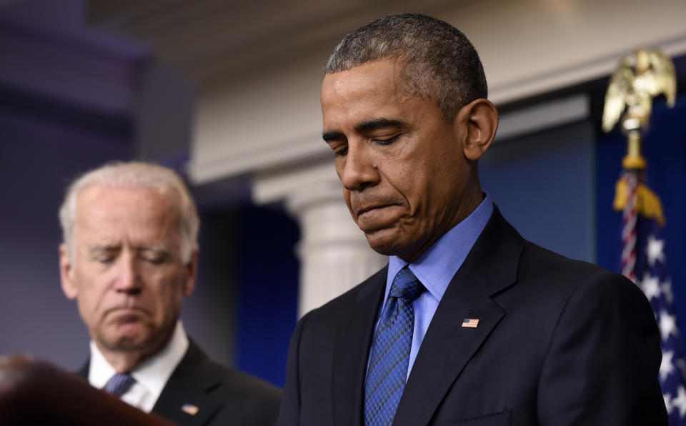 President Barack Obama, accompanied by Vice President Joe Biden, pauses while speaking in the Brady Press Briefing Room of the White House in Washington, Thursday, June 18, 2015, on the church shooting in Charleston, S.C., prior to his departure to Los Angeles.  (AP Photo/Susan Walsh)