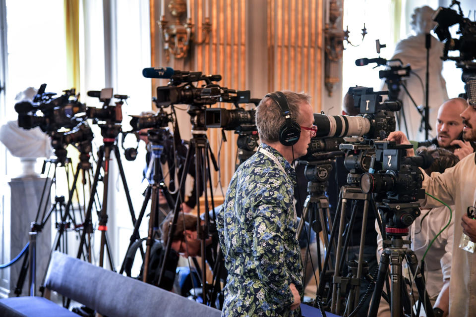 Journalists prepare themselves ahead of the announcement of the winners of the Nobel Prize in Literature 2019, in Stockholm, Sweden, Thursday Oct. 10, 2019. Two Nobel Prizes in literature will be announced Thursday after the 2018 literature award was postponed following sex abuse allegations that rocked the Swedish Academy a year ago. (Anders Wiklund / TT via AP)