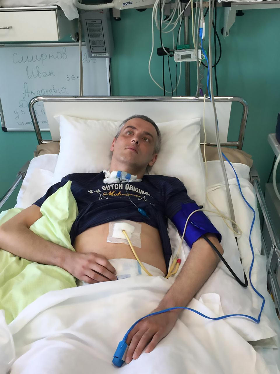 Pic Shows: Ivan Smirnov in Hospital;  This father of two is trapped in his own body being fully conscious but barely able to move or talk after doctors repeatedly misdiagnosed his stroke. 