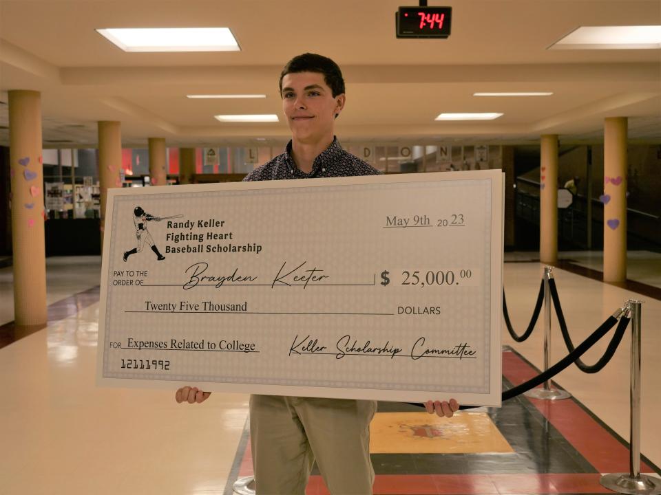 Tascosa's Brady Keeter poses with a $25,000 check he received for winning the Randy Keller Fighting Heart Baseball Scholarship on Tuesday, May 9, 2023 at Tascosa High School.