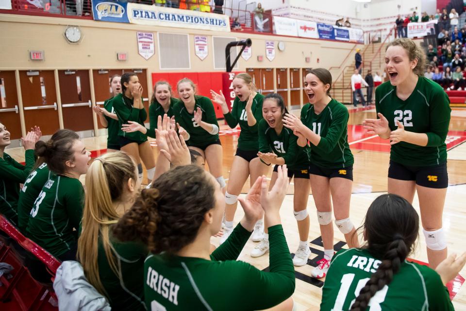 York Catholic players cheer before the start of the lineup introductions during the PIAA Class 2A volleyball championship against Freeport at Cumberland Valley High School on Saturday, Nov. 19, 2022, in Mechanicsburg.