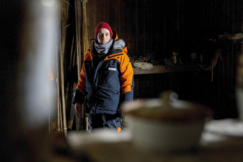 New Zealand Prime Minister Jacinda Ardern looks around Scott's Terra Nova hut at Cape Evans in Antarctica, Thursday, Oct. 27, 2022. Ardern this week is making a rare visit by a world leader to Antarctica. She's seeing firsthand the research on global warming that's taking place and marking the 65th anniversary of New Zealand's Scott Base, which will soon be demolished to make way for a new base. (Mike Scott/NZ Herald/Pool Photo via AP)