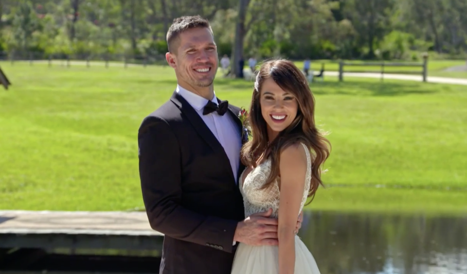 Drew and KC from Married At First Sight pose for their wedding photos