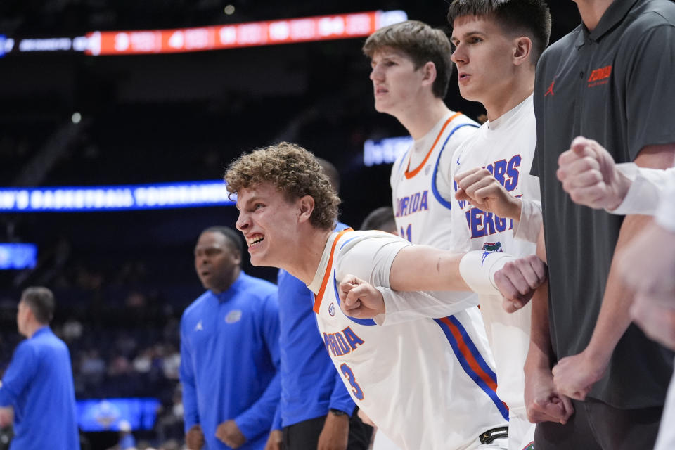 Florida center Micah Handlogten (3) reacts on the bench after a Gator's basket late in the second half of an NCAA college basketball game against Georgia at the Southeastern Conference tournament Thursday, March 14, 2024, in Nashville, Tenn. (AP Photo/John Bazemore)