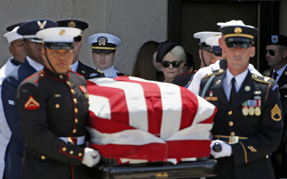 <p>Cindy McCain, back right, walks with her son Jack McCain, back left, as the follow the military honor guard carrying the casket of Sen. John McCain, R-Ariz., after a memorial service at North Phoenix Baptist Church Thursday, Aug. 30, 2018, in Phoenix. (Photo: Ross D. Franklin/AP) </p>