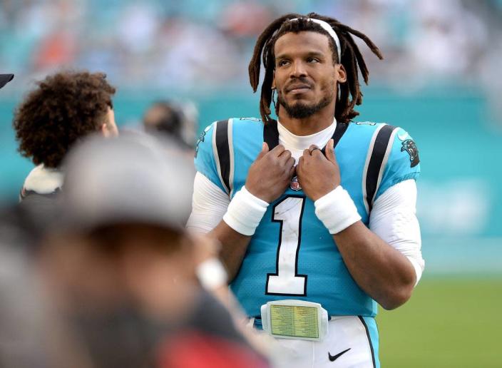 Carolina Panthers quarterback Cam Newton stands on the team&#x002019;s sideline in the fourth quarter. Newton had a career-worst 5.8 quarterback rating in Carolina&#x002019;s 33-10 loss to Miami.