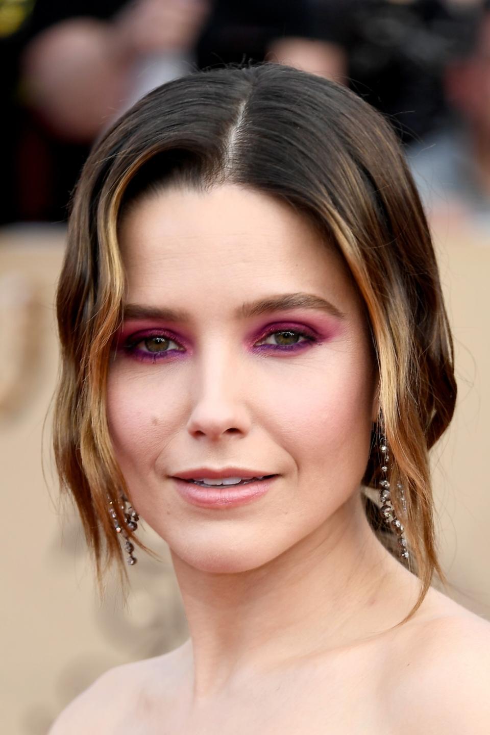 <p>Sophia went for a bold beauty statement, opting for bright pink eyeshadow to match her hot pink dress and it definitely paid off. [Photo: Getty] </p>