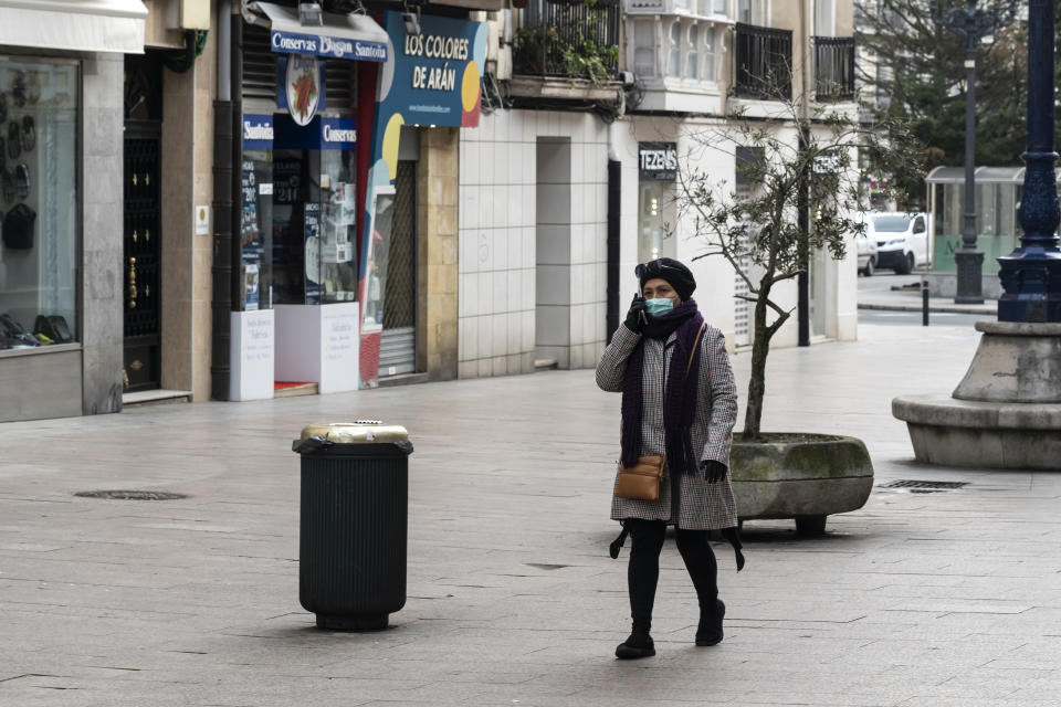 A young woman protected by a mask in a central street of the city by the mandatory one decreed by the government as a consequence of the coronavirus (Covid-19) in Santander (Photo by Joaquin Gomez Sastre/NurPhoto via Getty Images)
