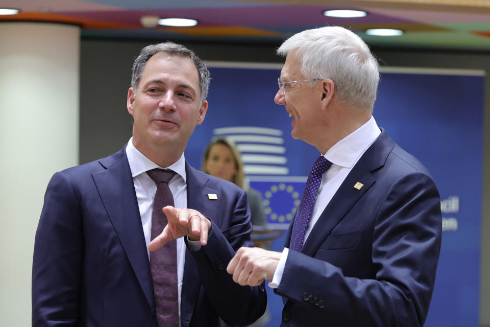 Belgium's Prime Minister Alexander De Croo, left, speaks with Latvia's Prime Minister Krisjanis Karins during a round table meeting at an EU summit in Brussels, Thursday, March 23, 2023. European Union leaders meet Thursday for a two-day summit to discuss the latest developments in Ukraine, the economy, energy and other topics including migration. (AP Photo/Olivier Matthys)