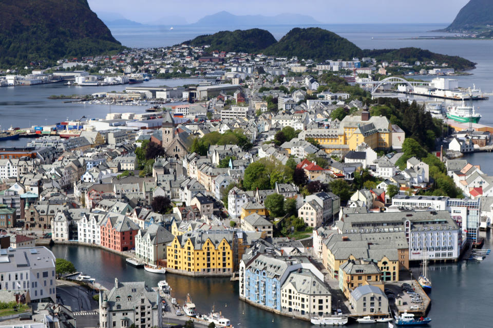 This May 29, 2019 photo shows an aerial view of the city of Alesund, Norway, viewed from Mount Aksla. Alesund was rebuilt in the Art Nouveau style of architecture after a devastating fire in 1904. (AP Photo/Brian Witte)