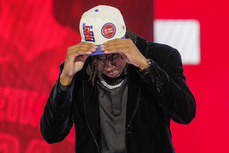 Jaden Ivey dons a Detroit Pistons hat after being selected fifth overall by the Pistons in the NBA basketball draft, Thursday, June 23, 2022, in New York. (AP Photo/John Minchillo)