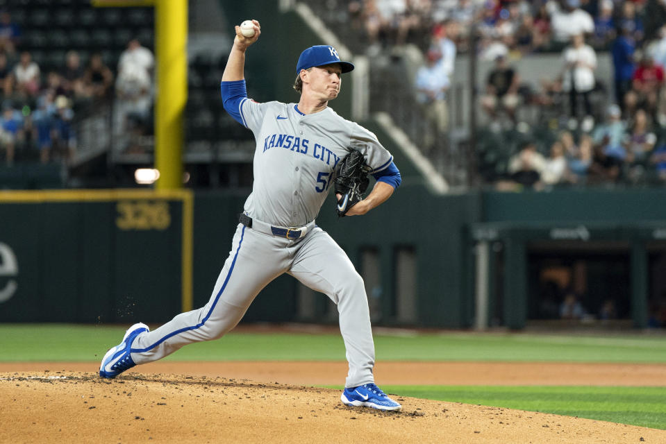 Kansas City Royals starting pitcher Brady Singer works against the Texas Rangers during the first inning of a baseball game Friday, June 21, 2024, in Arlington, Texas. (AP Photo/Jeffrey McWhorter)