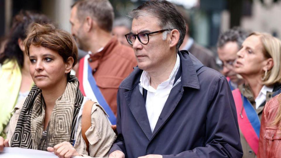 Najat Vallaud-Belkacem (L) and the first secretary of the French Socialist Party (PS), Olivier Faure, participate in an anti-extreme right rally