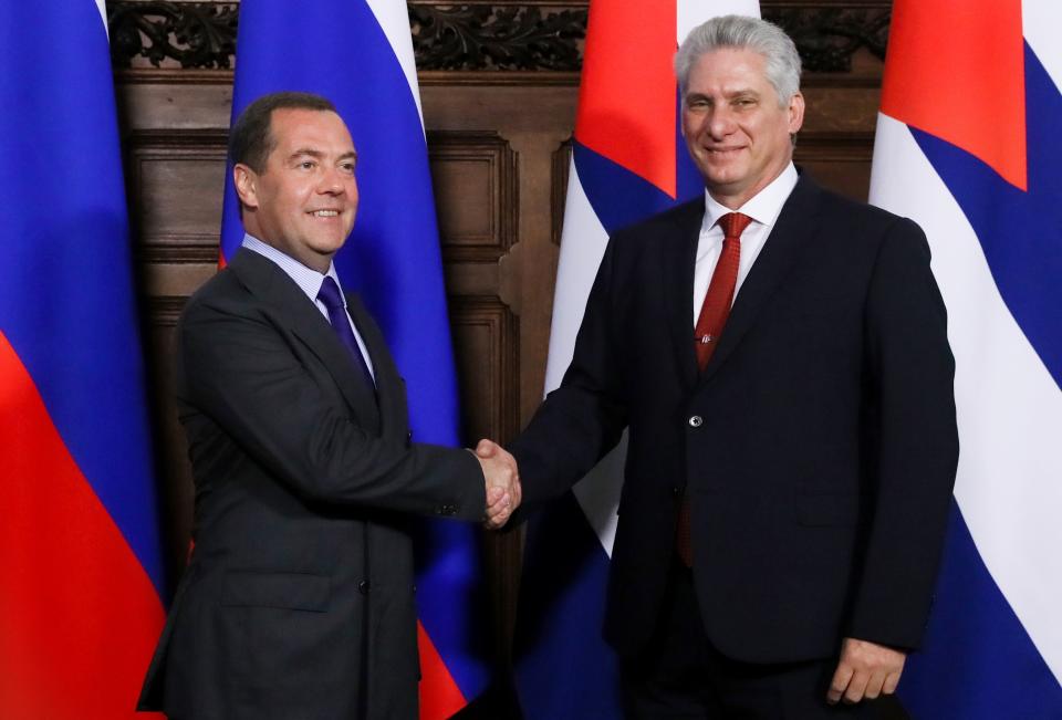 Russian Prime Minister Dmitry Medvedev, left, and Cuban President Miguel Diaz-Canel pose for a photo prior to their talks in Moscow, Russia, Tuesday, Oct. 29, 2019. (Yekaterina Shtukina, Sputnik, Government Pool Photo via AP)