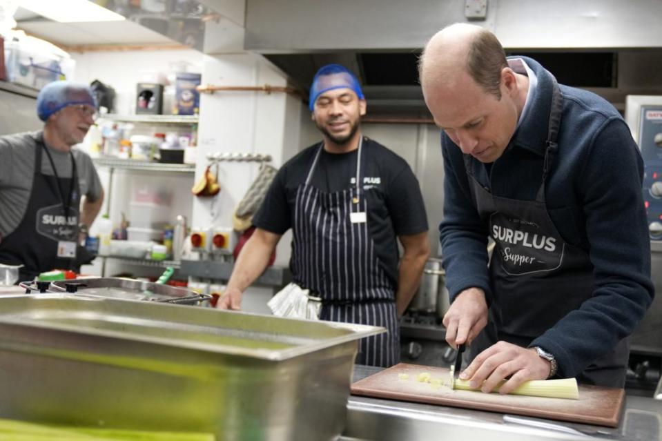 The father of three was pictured smiling as he chopped up some vegetables. AP